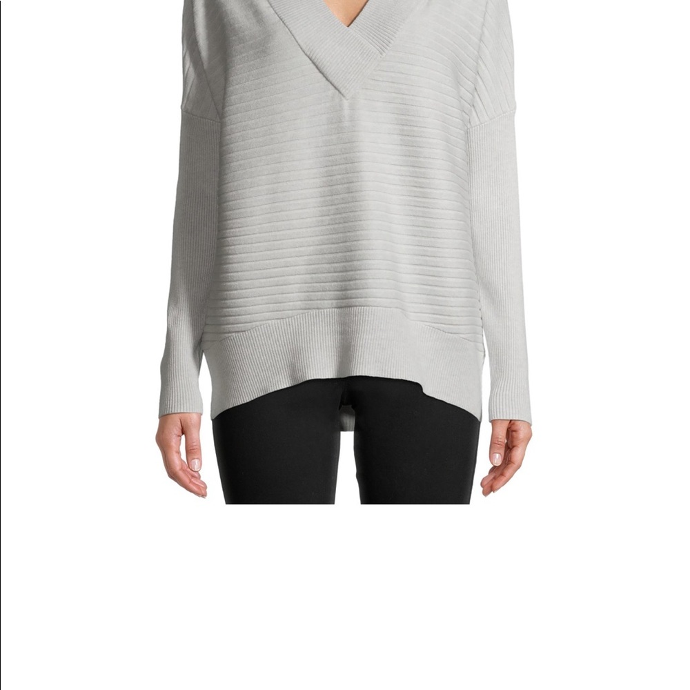 Time and Tru's V-neck sweater creates a timeless look. Layered or solo,